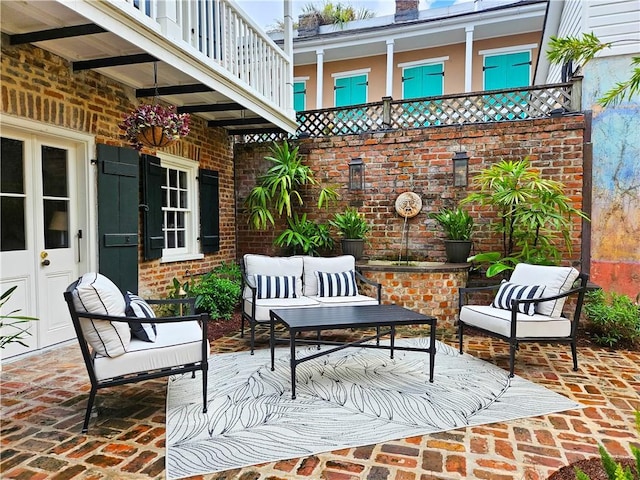 view of patio / terrace with outdoor lounge area and a balcony