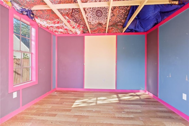 unfurnished room featuring wood-type flooring