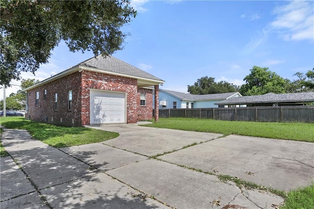 view of home's exterior with a lawn and a garage