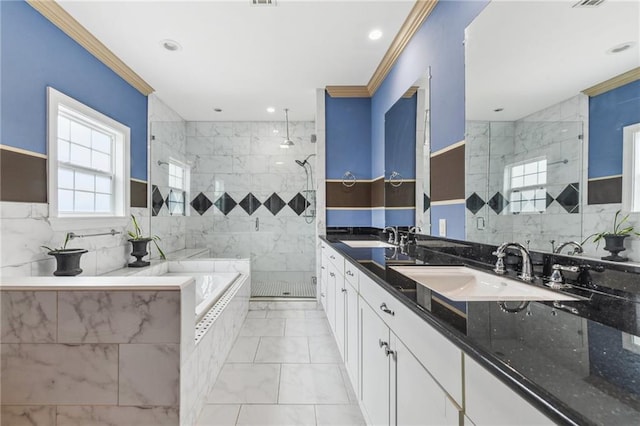 bathroom with independent shower and bath, vanity, tile walls, and crown molding