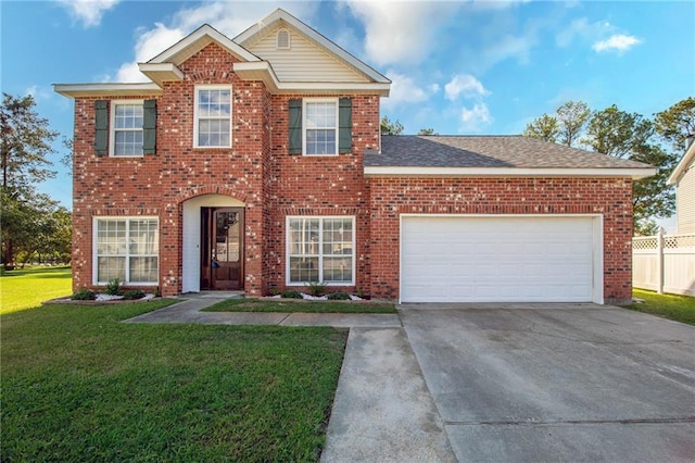 view of front of property with a front lawn and a garage