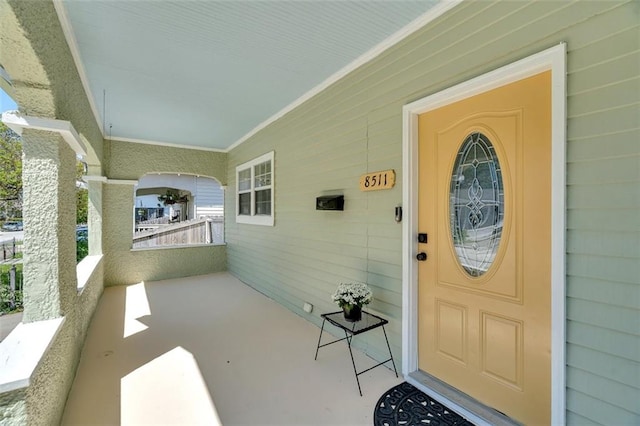 doorway to property with covered porch