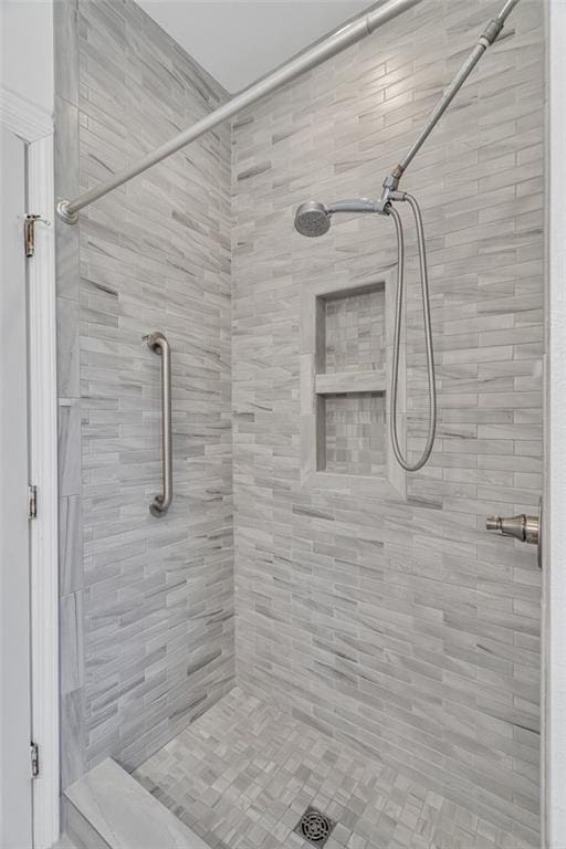 bathroom with tiled shower