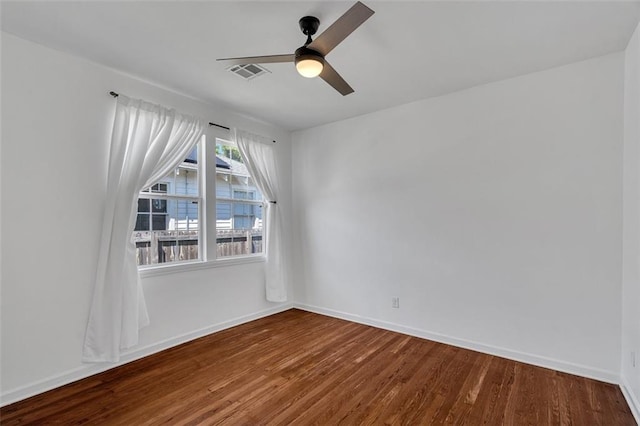 empty room featuring hardwood / wood-style floors and ceiling fan