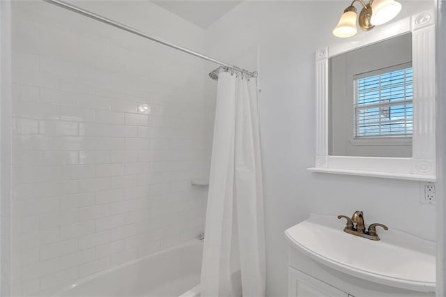 bathroom with shower / bath combo and vanity