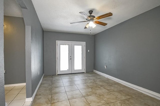 interior space with ceiling fan and french doors