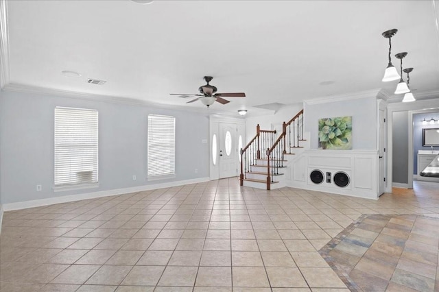 unfurnished living room with ceiling fan, ornamental molding, and light tile patterned floors