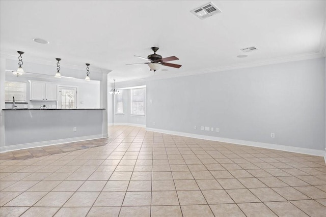 unfurnished living room with crown molding, light tile patterned floors, and ceiling fan with notable chandelier