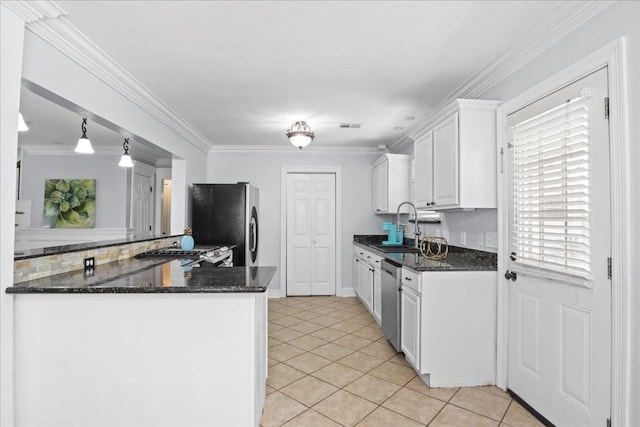 kitchen with white cabinets, sink, pendant lighting, crown molding, and stainless steel appliances