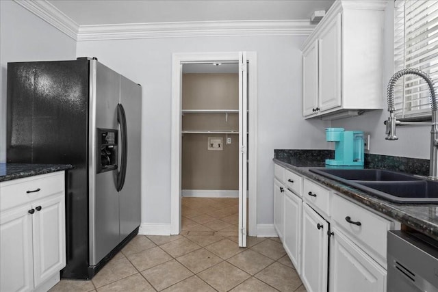 kitchen featuring crown molding, stainless steel appliances, sink, and white cabinets