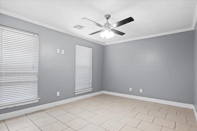 empty room with crown molding, light tile patterned flooring, and ceiling fan