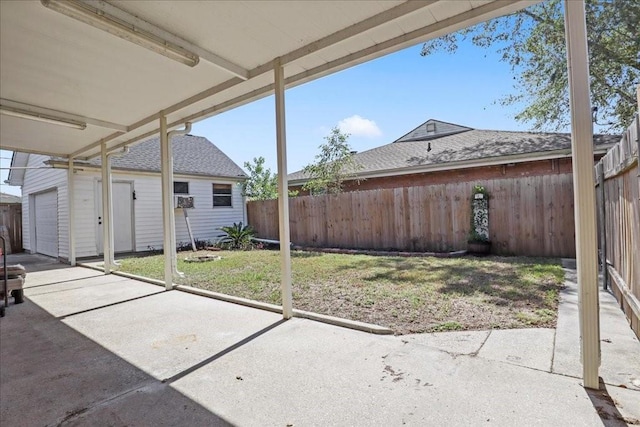 view of patio featuring a garage