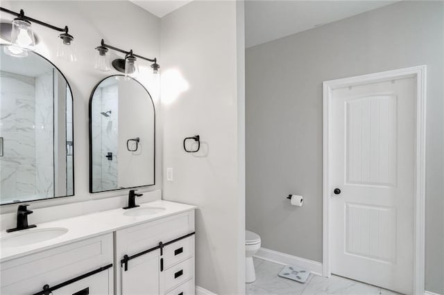 bathroom with a shower with door, vanity, and toilet