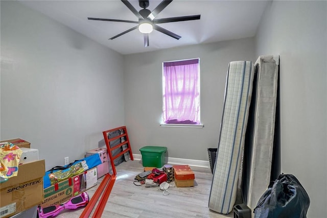 recreation room featuring wood-type flooring and ceiling fan