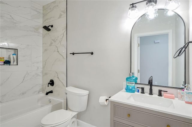 full bathroom featuring tiled shower / bath combo, vanity, and toilet