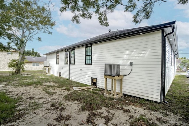 back of property featuring central AC unit