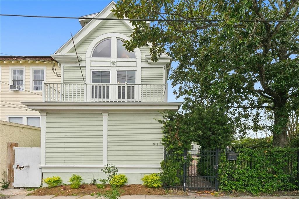 view of side of property featuring a balcony