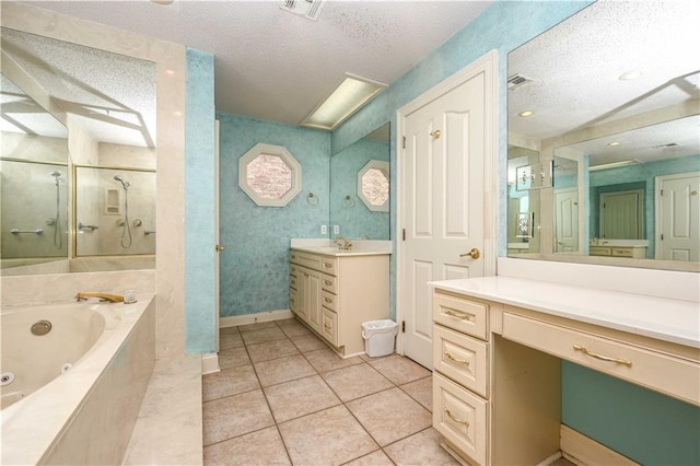 bathroom with vanity, plus walk in shower, a textured ceiling, and tile patterned floors