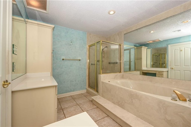 bathroom with vanity, separate shower and tub, tile patterned flooring, and a textured ceiling