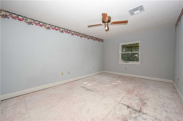 spare room featuring ceiling fan and a textured ceiling