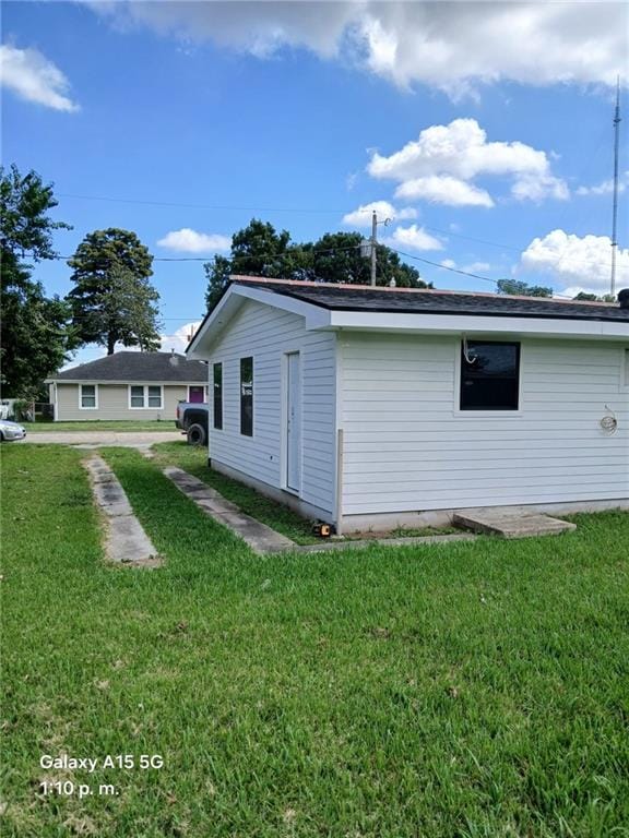 view of home's exterior with a lawn