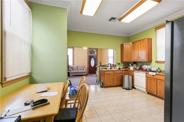 kitchen featuring stainless steel refrigerator, light tile patterned flooring, ornamental molding, and dishwasher