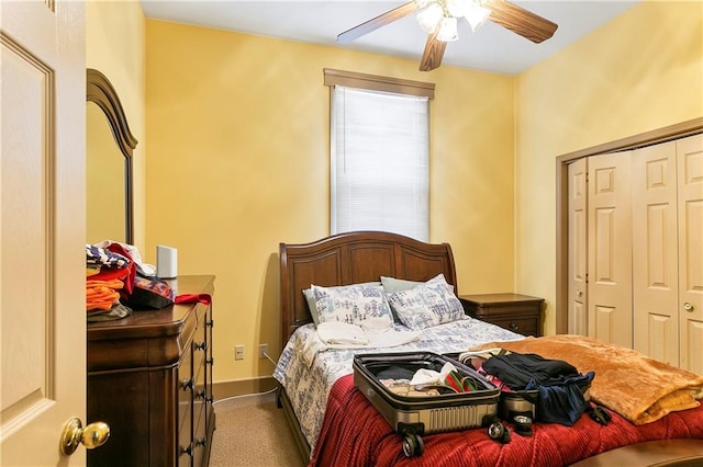 bedroom with carpet flooring, ceiling fan, and a closet