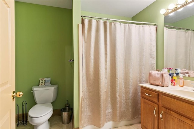 bathroom with tile patterned floors, curtained shower, vanity, and toilet