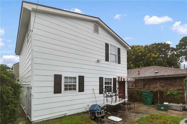 rear view of property featuring a patio