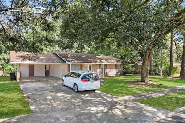 ranch-style home with a carport and a front lawn