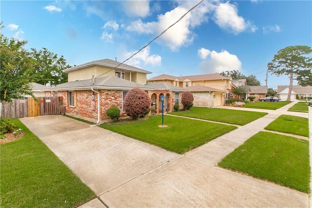 mediterranean / spanish-style house with a garage and a front lawn