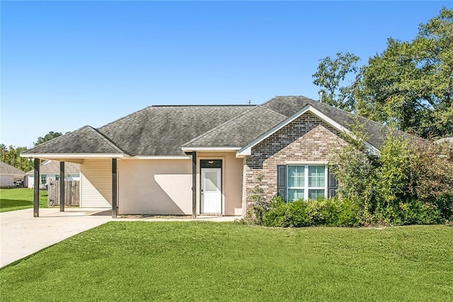 ranch-style home with a carport and a front lawn