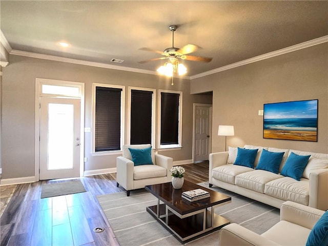 living room featuring crown molding, wood-type flooring, and ceiling fan