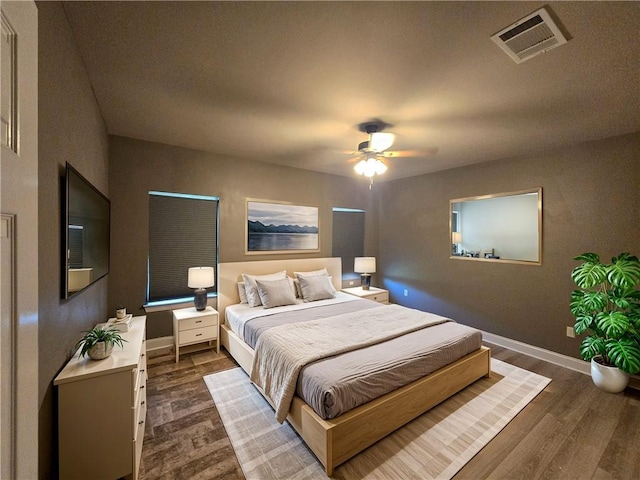 bedroom featuring ceiling fan and dark hardwood / wood-style flooring