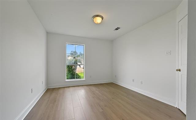 unfurnished room featuring hardwood / wood-style floors