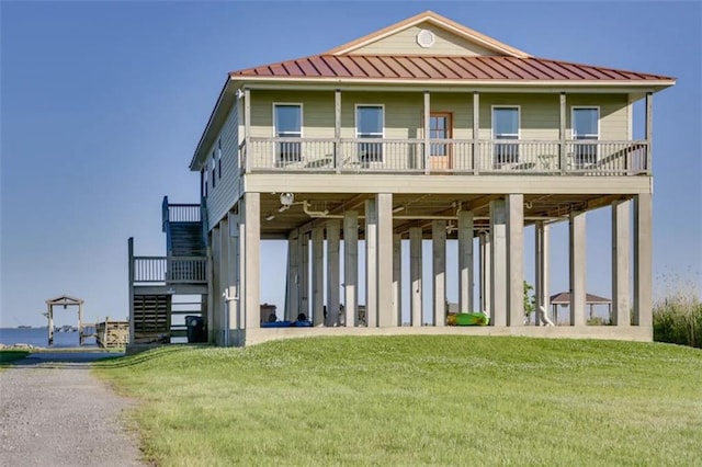 rear view of property with a lawn