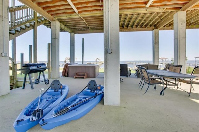 view of patio with a grill and a hot tub