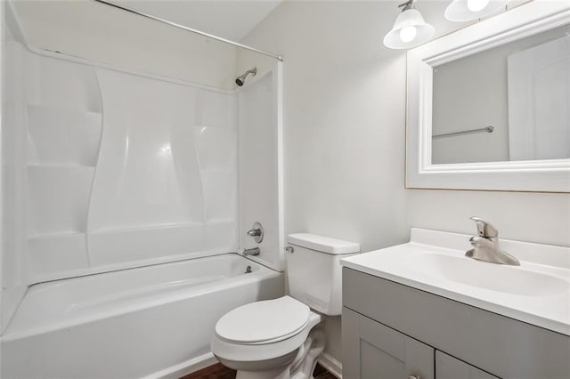 full bathroom with vanity, toilet, and washtub / shower combination