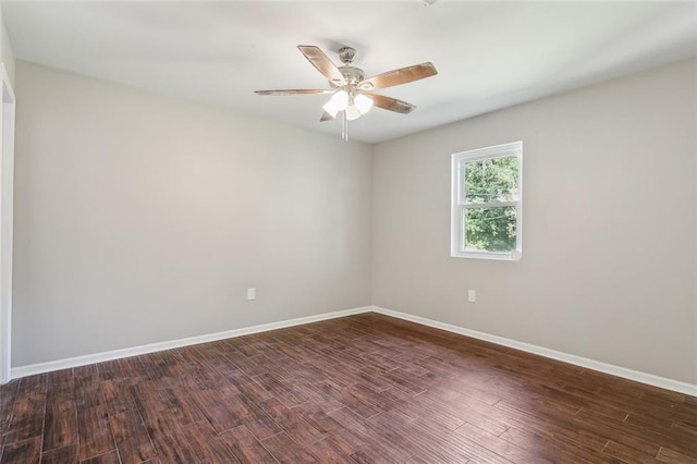 unfurnished room with ceiling fan and dark hardwood / wood-style floors