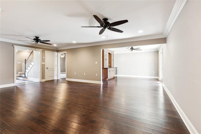 unfurnished living room featuring crown molding and dark wood-type flooring