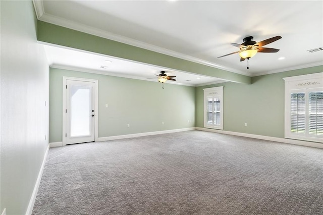 spare room featuring ornamental molding, carpet flooring, and ceiling fan