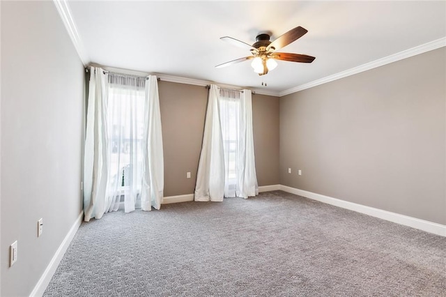 carpeted empty room with ornamental molding and ceiling fan