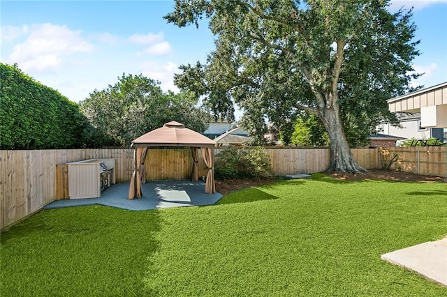 view of yard with a gazebo and a patio