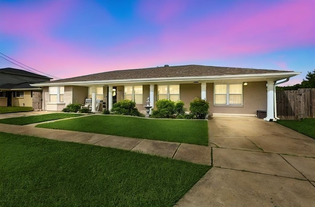 ranch-style house featuring a lawn