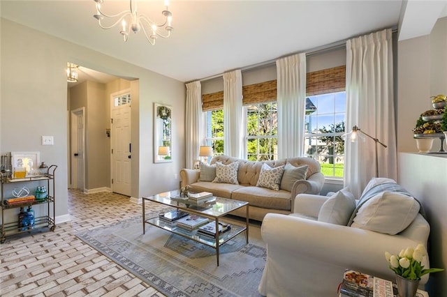 living room featuring a notable chandelier