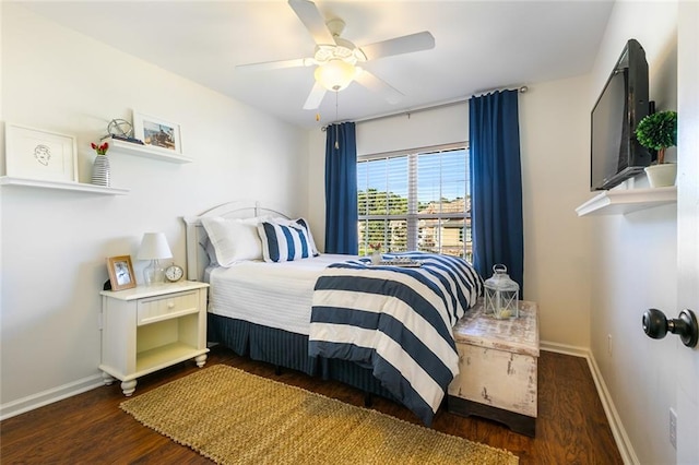 bedroom with dark hardwood / wood-style floors and ceiling fan