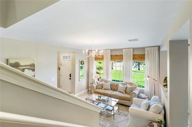 living room featuring an inviting chandelier