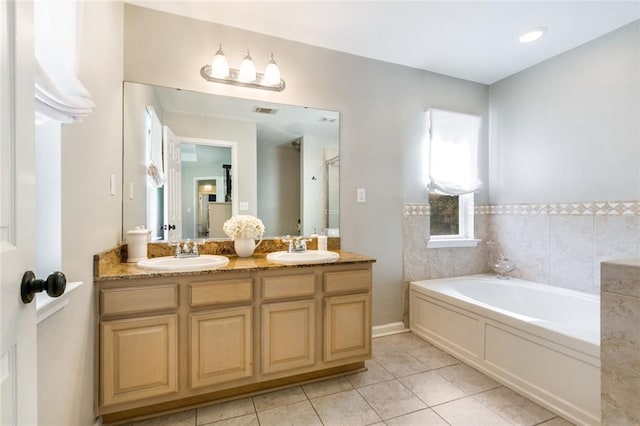 bathroom with tile patterned floors, independent shower and bath, and vanity