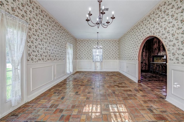 unfurnished dining area with a chandelier