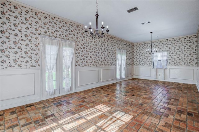 unfurnished dining area with an inviting chandelier